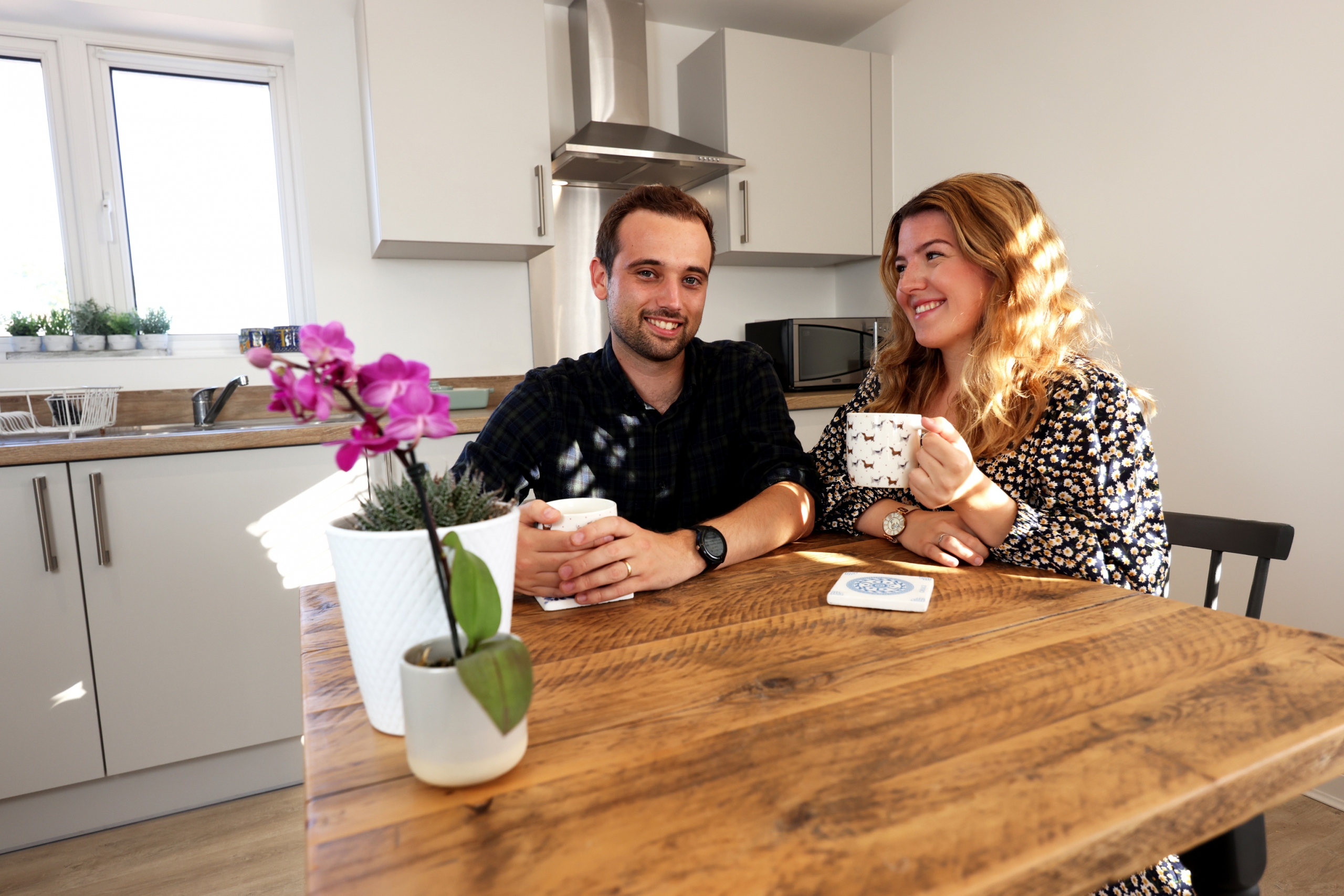 Young couple at kitchen table
